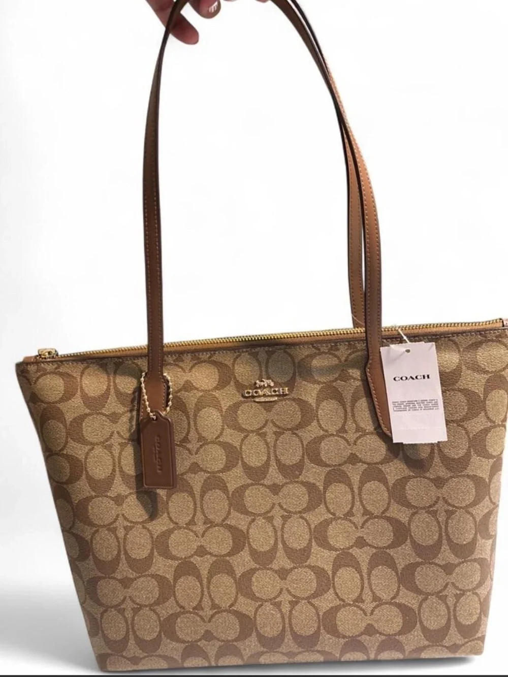 Coach NWT Signature Canvas Zip Top Tote Bag in the color Khaki/Saddle